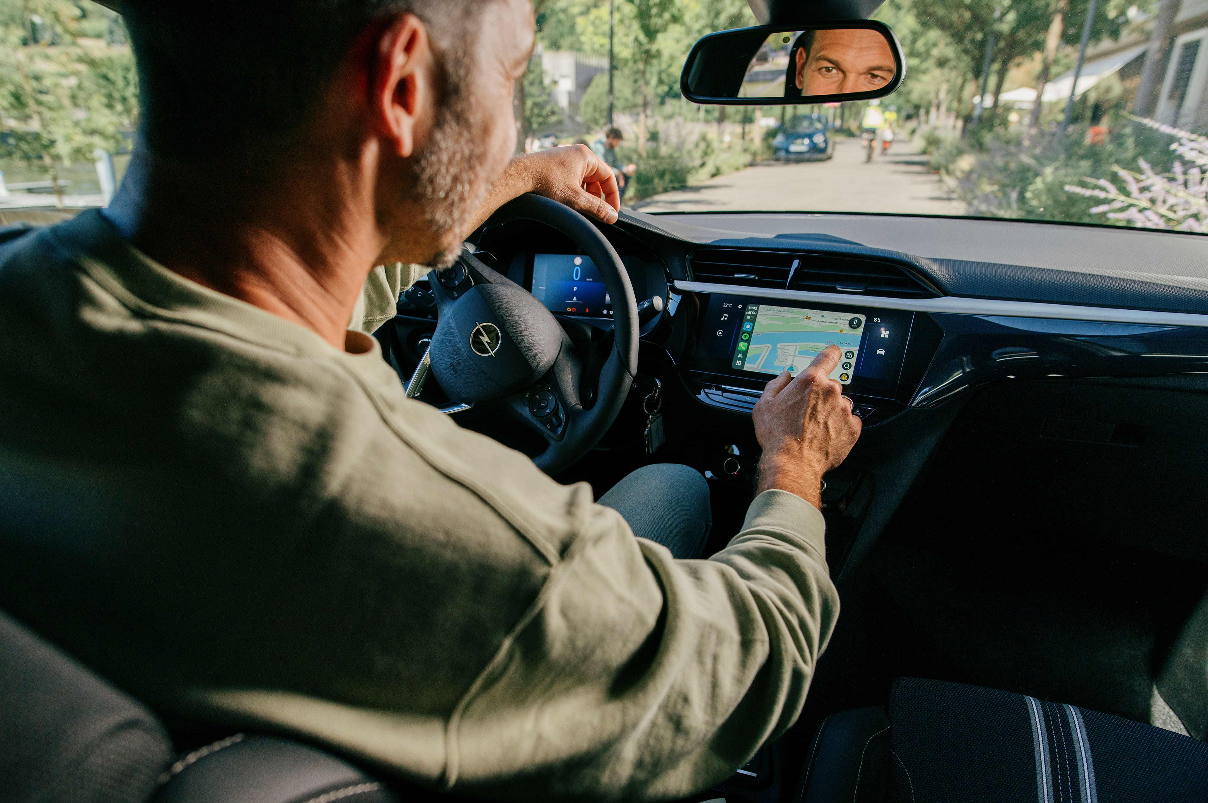 A man in his car using the GPS