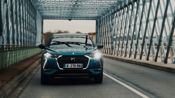 A blue DS 3 Crossback on a bridge